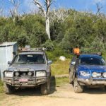 panoramic photo of bluff hut and 4wd's
